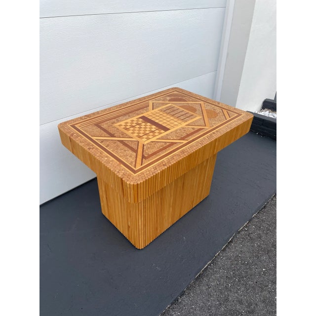 This is possibly a One-Of-A-Kind table. It is made of both bamboo dowels and inlaid woods. The height is an end table /...