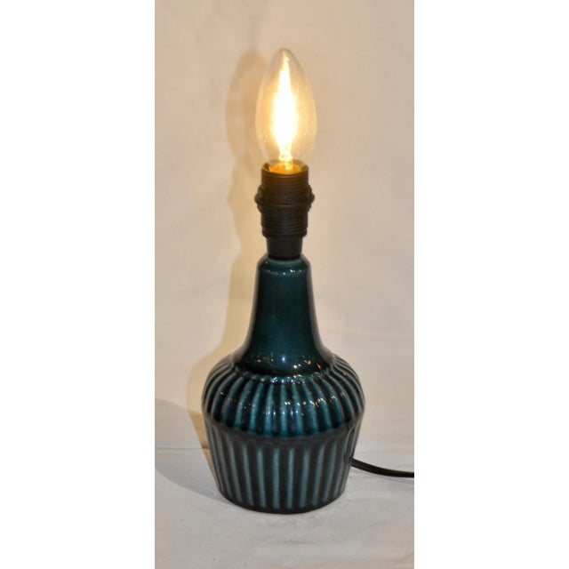 Dark Blue Secle Table Lamp, in Very Good conditions. Designed 1970 to 1979 This piece is attributed to the mentioned...