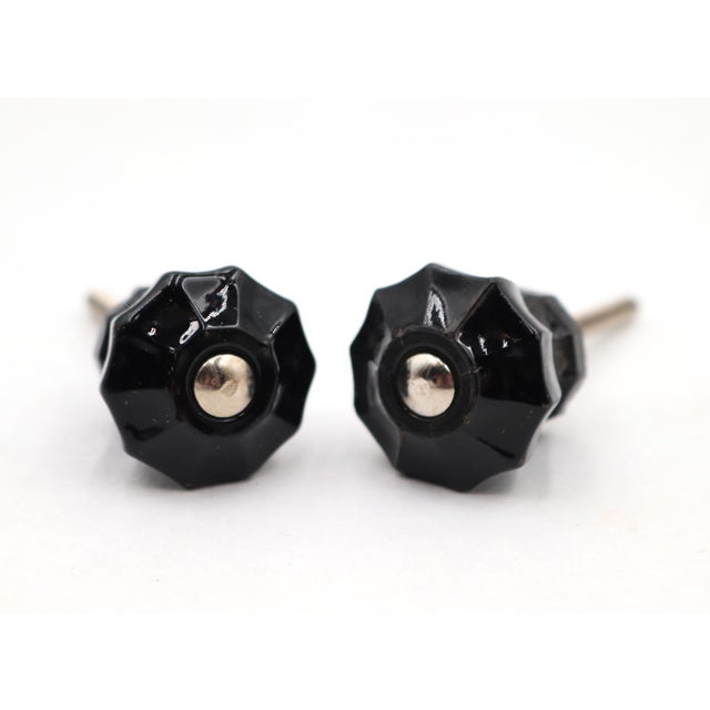 Vintage cabinet or drawer knobs made of black glass with a fluted shape. The original mounting nuts are not included. Good...