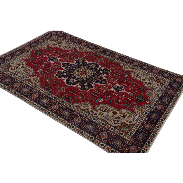 Hand knotted in wool, a vintage 4x7 Persian Tabriz rug originating circa 1970-1980 - making its way to our reputed Antique...