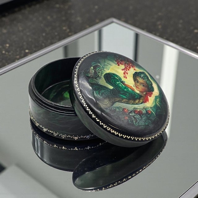 A finely executed Russian hand-painted lacquer box signed and dated 1996 by artist S. Sorkin. The domed lid features a...