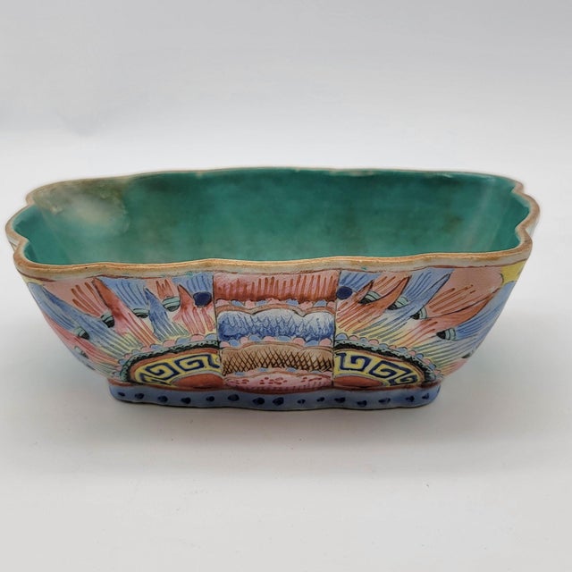 This antique Famille Rose porcelain bowl, originating from the Guangxu period, features intricate hand-painted designs....