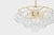 Swirl-ribbed or plated champagne glass globes dangle from an Aged Brass frame, creating this cloud-like showstopper....