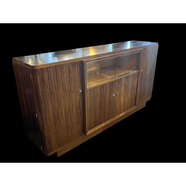 sideboard in Macassar ebony made by the Vallin workshops in Nancy in the 40s large storage capacity with shelves on either...