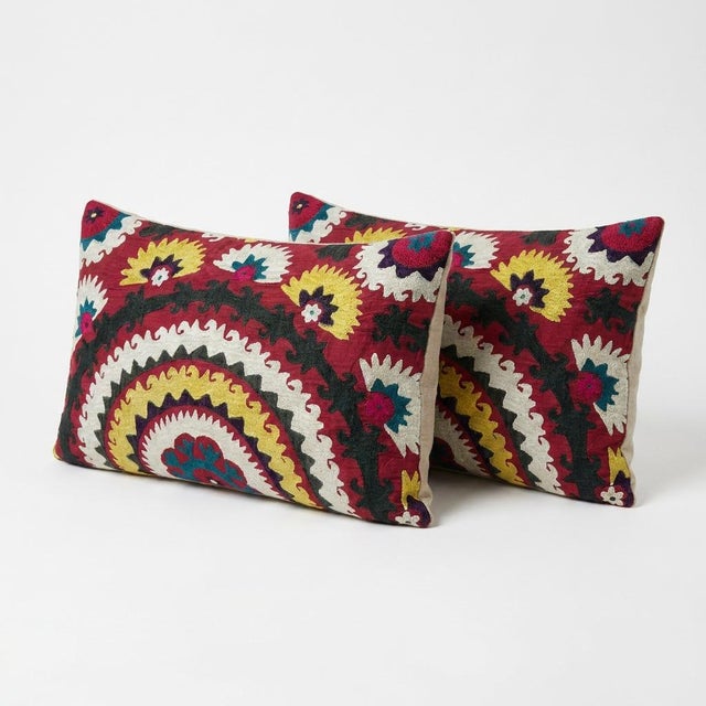 This beautiful 18'' x 32'' & 17'' x 32'' hand-embroidered Suzani pillow cover set was made from authentic Uzbek cotton...