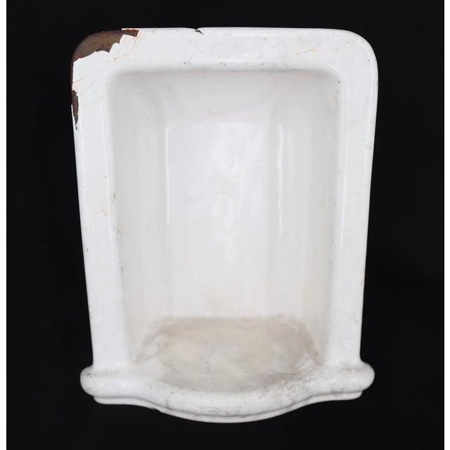Antique recessed soap dish made of white enameled cast iron with an arched, tall style. Good condition with surface wear...