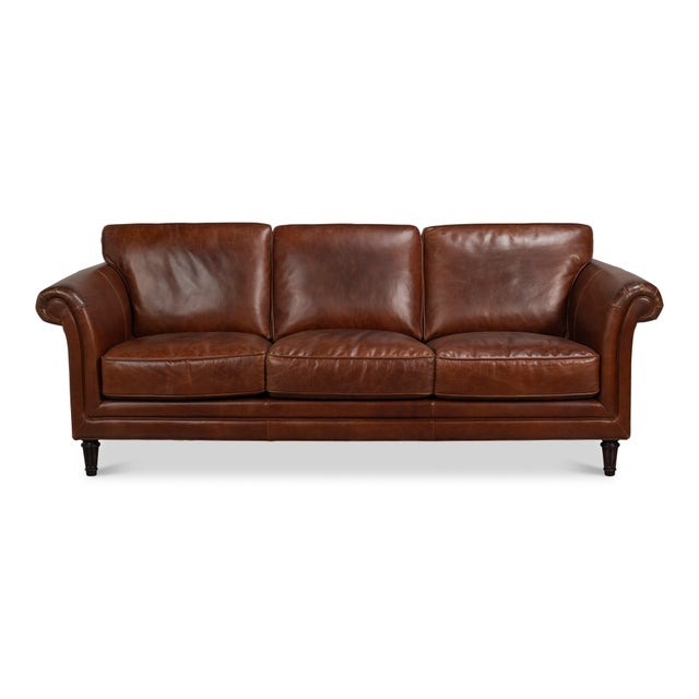 An 82-inch span gives three people room to sit without the footprint of an oversized sofa. This one wears chestnut brown...