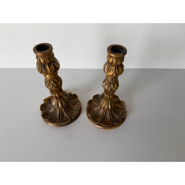 A charming pair of vintage Italian Florentine-style candleholders, beautifully hand-carved in wood and finished in a rich...