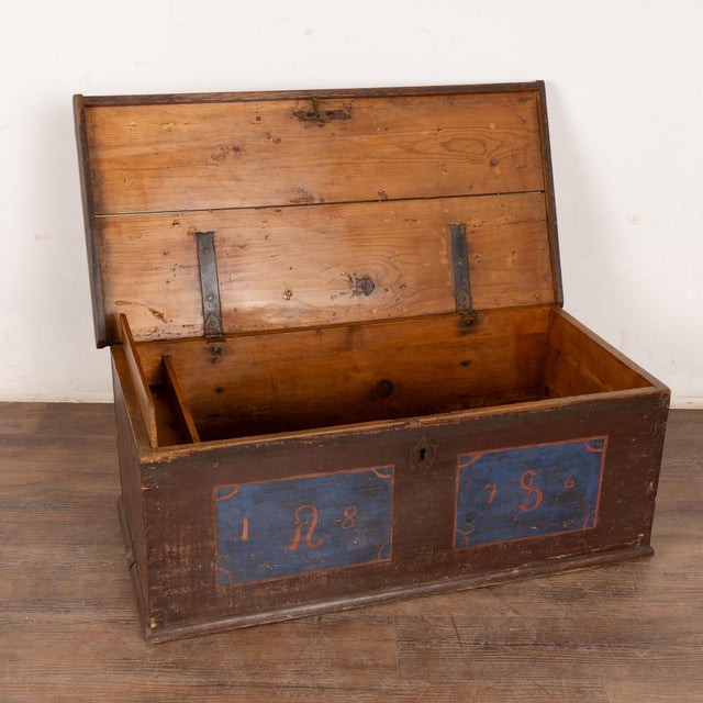 Antique original hand painted pine trunk dated 1876 with monogram of "AS." The original painted finish has been worn and...