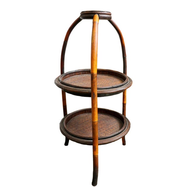 This charming vintage end table features two circular tiers, providing ample space to showcase your favorite decor pieces...