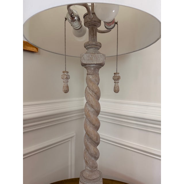 Elegant barley twist table lamp in a weathered bleached wood finish, featuring a classic spiral-turned column on stepped...