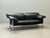 Elegant three-seater sofa, model *pause*, designed by pierluigi cerri for poltrona frau in the 1990s. The design combines...