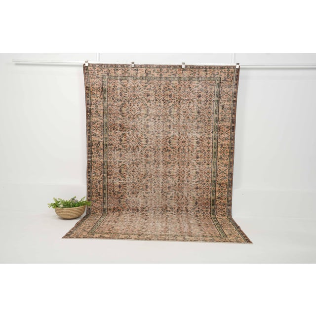 Vintage Hand-Knotted runner rug is a semi-antique vintage area rug. The '70s Eastern region of Anatolia's unique rug is...