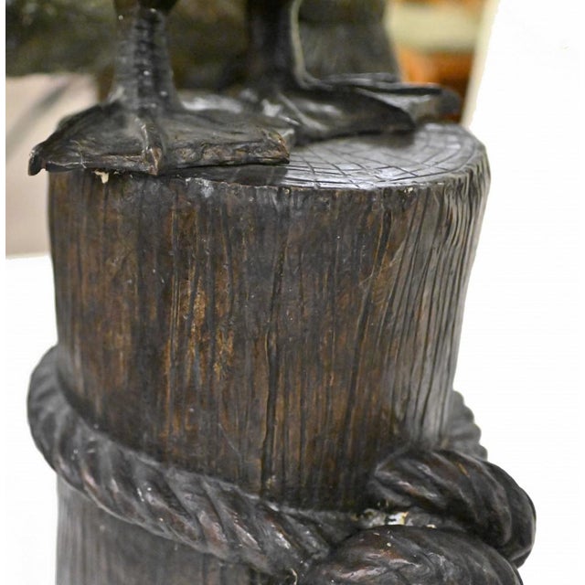 - Wonderful pair of giant bronze pelicans standing on boat mooring stumps - Classic Pacific sea bird, very Californian -...