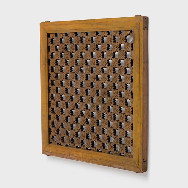 This antique lattice window panel from the early 20th century likely originated in a northern Chinese home with neutral...