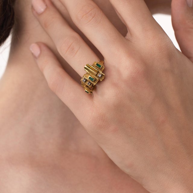 This elegant vintage emerald and diamond ring is a polished 1970’s design, featuring 3 baguette cut emeralds weighing...