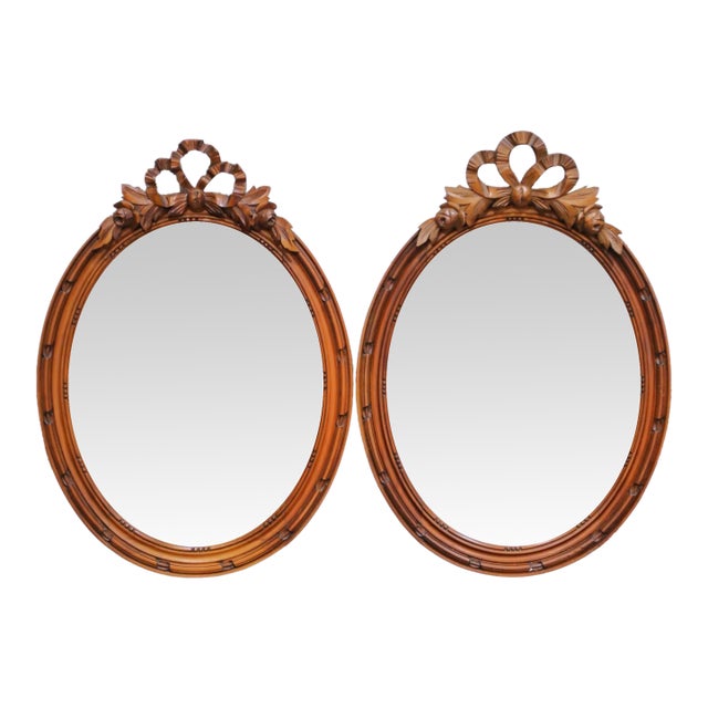 Pair of 19th Century French Louis XVI Oval Walnut Mirrors With Ribbon Crest For Sale