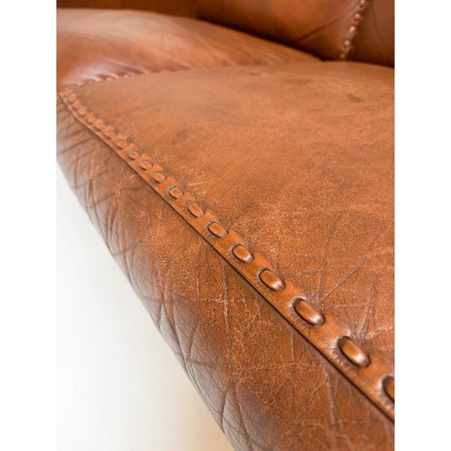 Sturdy and very comfortable brown leather designer sofa by Aage Christiansen for Erhardsen & Andersen from the 1960s. The...