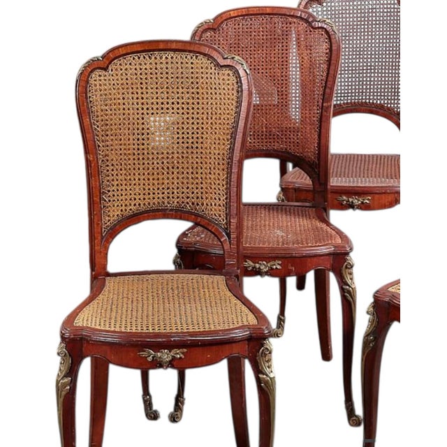 Set of 10 Antique Louis XV Gilt Bronze Mounted Cane & Walnut Dining Chairs.