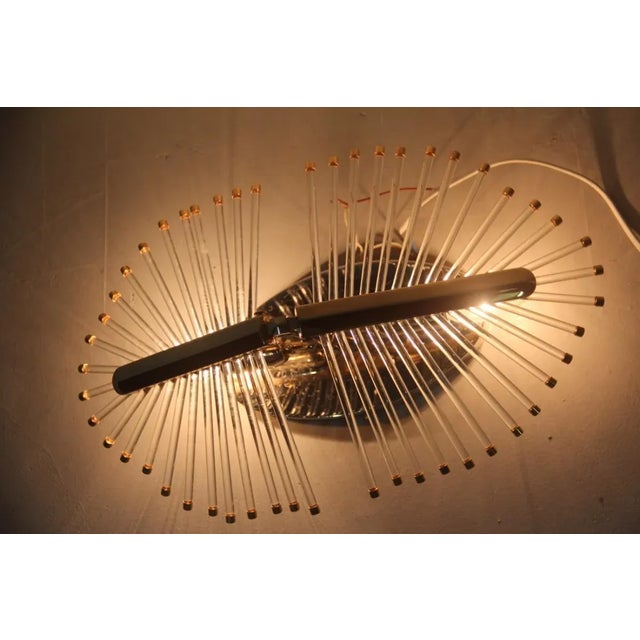 This ceiling lamp was designed by Gaetano Sciolari in 1970 and was produced in Italy in the same period. It is made from...