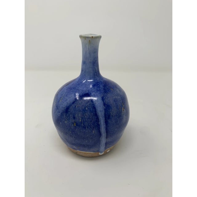 Beautiful periwinkle blue miniature vase. Adds a perfect pop of color to any space.
