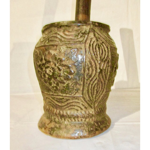 Antique cast Iron mortar and cast iron pestle fro grinding powders from grains or herbs. Surface deign is simple floral...