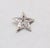 1950s rhodium plated round and baguette clear rhinestones star with cut out center brooch with security clasp. Marked...