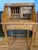 Oak rolltop secretary desk. Judging by the stain color I'd say that it would have been a perfect fit in someone's home in...