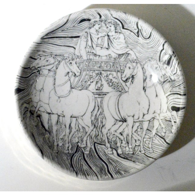 Classical Speed: Fornasetti's Roman Chariot Ceramic Ashtray Object: Ashtray (or vide-poche) Designer: Piero Fornasetti...