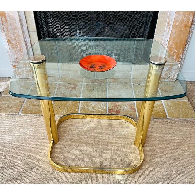 For your review... a Leon Rose era brass and glass side table by PACE Collection. This Hollywood Regency style piece is...