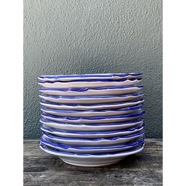 This vibrant set of twelve hand-painted fish plates comes from the esteemed workshops of L’Antica Deruta in Italy, created...