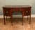 Elegant Sheraton style mahogany sideboard, dating to the early 20th century, circa 1900-1920 The sideboard features a...