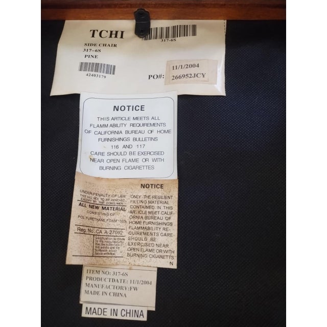 These four chairs are crafted from solid pine wood and decorated with leather strips. They are upholstered in fine black...