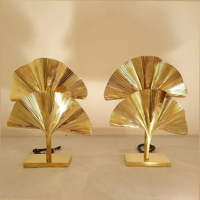 Pair of Ginko Biloba table or desk lamps, Italy circa 2010s. The Italian lamps are made of two hammered brass ginko leaves...