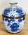 Vintage porcelain vibrant blue and white floral motif lidded jar. Brass strip at frame and handle. Patina to brass. No...