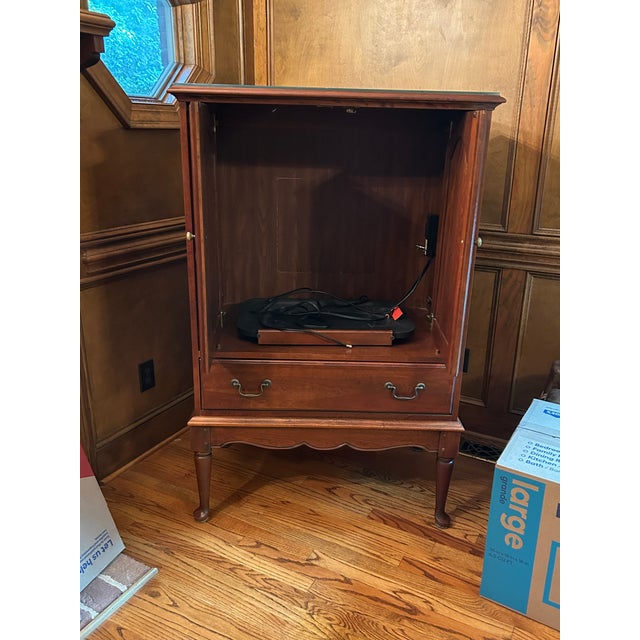 Vintage cherry television hutch comes with custom cut glass top.