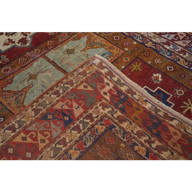 The tomato red field displays seven separate panels in dark red, green, navy, straw and beige. Birds in central green...