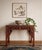 An exquisite 19th-century Chinese console table featuring exceptionally detailed, hand-carved openwork aprons and...