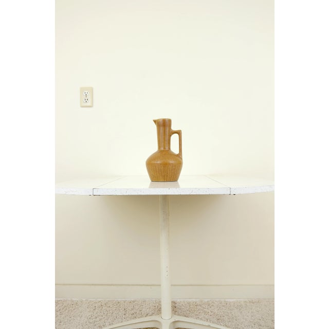 This vintage ceramic decorative pitcher is in excellent condition, free from chips, cracks, or scratches. There is some...