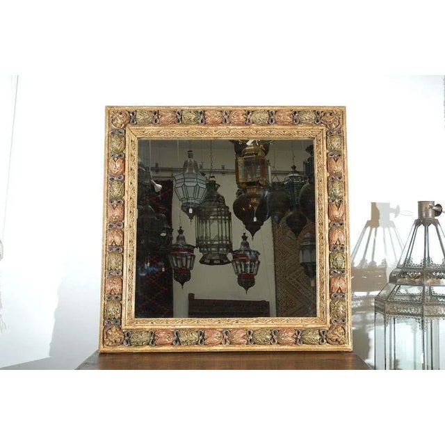 Venetian Moorish Style Hand-Carved Polychrome Mirror, Italy, circa 1960s A striking vintage Italian mirror showcasing an...