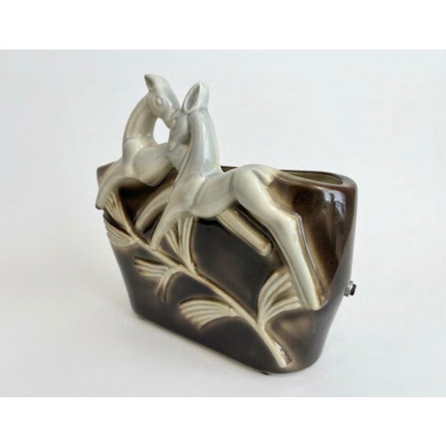 Add a touch of retro charm to your space with this stunning Mid-Century Modern ceramic piece! Featuring two graceful,...