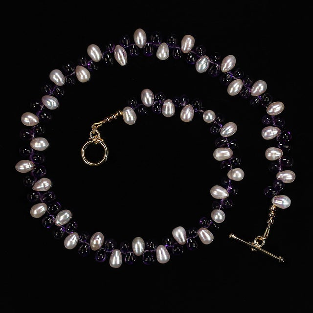 This exquisite 18‑inch necklace is a truly unique, one‑of‑a‑kind piece designed to captivate with its graceful blend of...