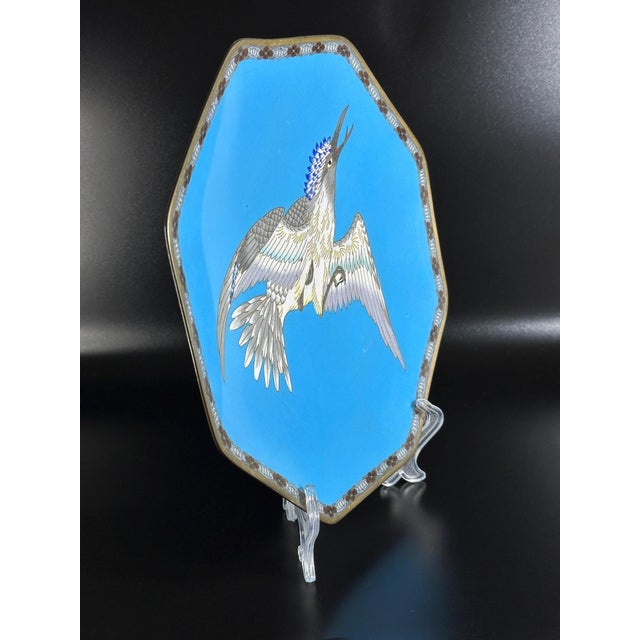 A striking Japanese cloisonné plate from the Meiji era, octagonal in shape and vividly enameled in a vibrant turquoise-...