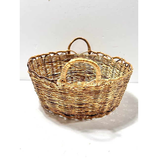 A classic handwoven wicker bread basket featuring a warm honey patina and beautifully wrapped loop handles. This versatile...