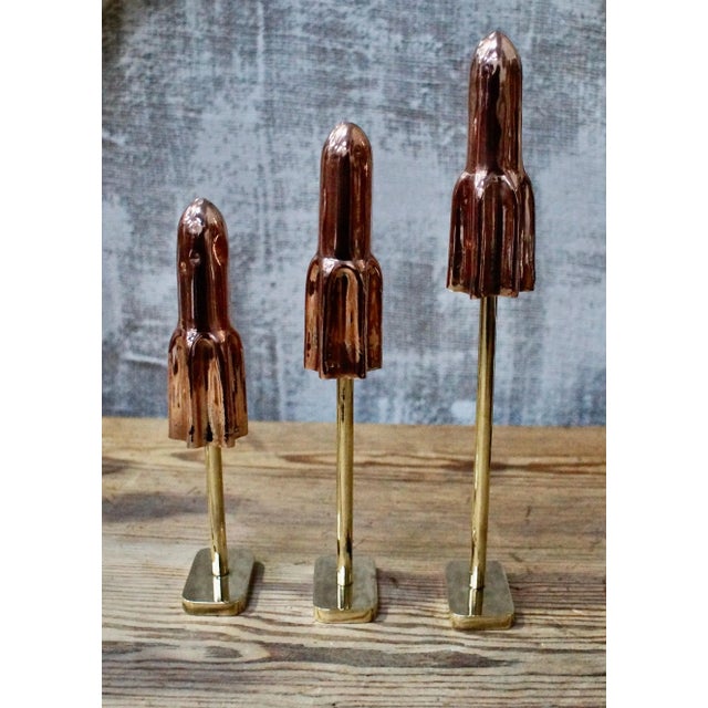 These stunning original 1940’s wall's rocket lolly moulds have been cast in copper and mounted on a beautiful brass stand...