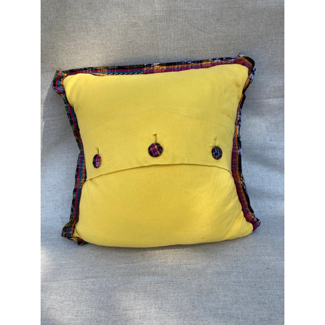 A pillow made from a hand woven Guatemalan multicolored cotton textile, backed with coordinating cotton/wool blend fabric....