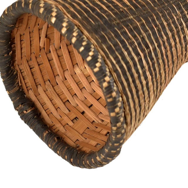 The Tutsi Wedding Basket Vase, originating from Rwanda, stands as a unique masterpiece of Rwandan artistry and cultural...