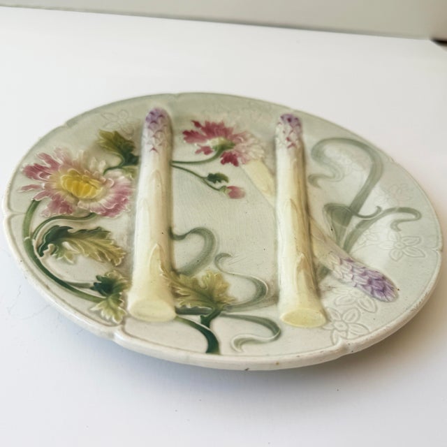 Beautiful antique French K&G St. Clément asparagus plate, circa late 19th/early 20th century. Creamy white ground with...