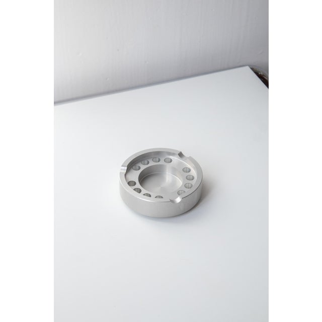 An elegant machined metal ashtray from the 1970s, in the style of Pierre Vandel, known for his geometric and minimalist...