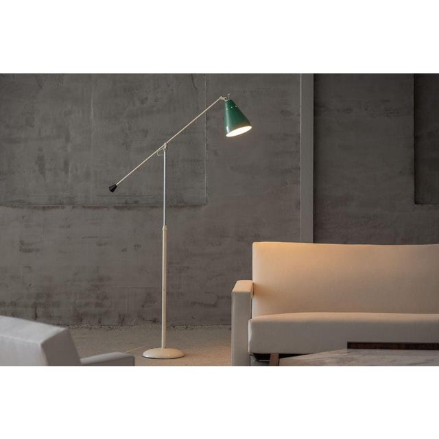 This rare and elegant minimalist floor lamp, model 6332, was designed by Wim Rietveld and manufactured by Gispen in...